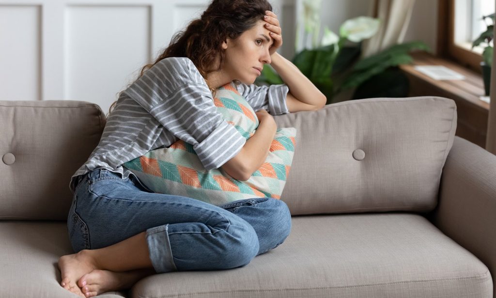 Lady feeling stressed and anxious at home