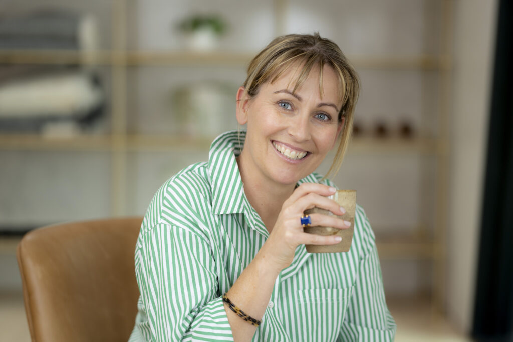 Photo of Sarah Percy registered Dietitian with a coffee